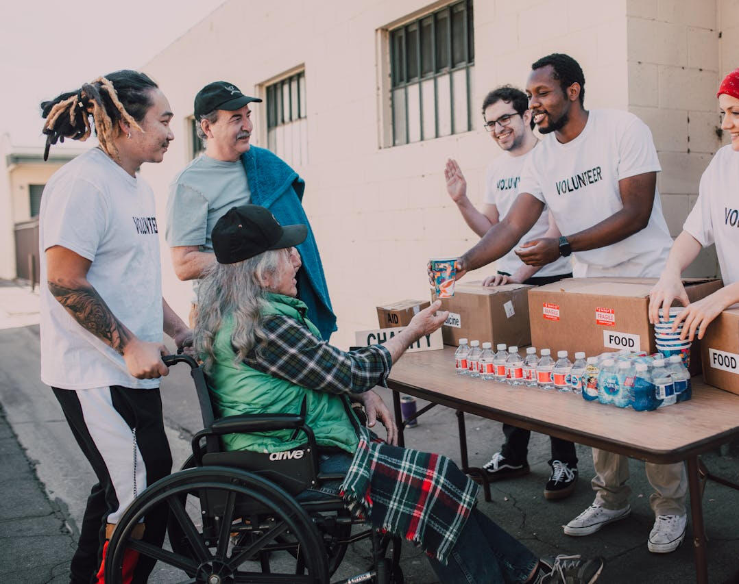 Volunteers Giving Aid Volunteers Giving Aid